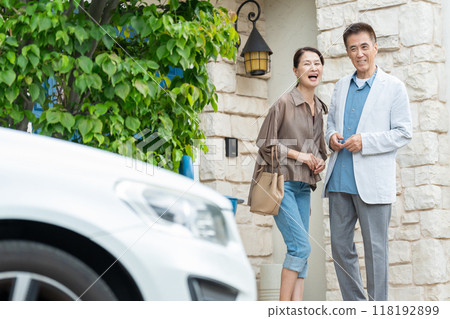 Middle-aged couple, house, car 118192899