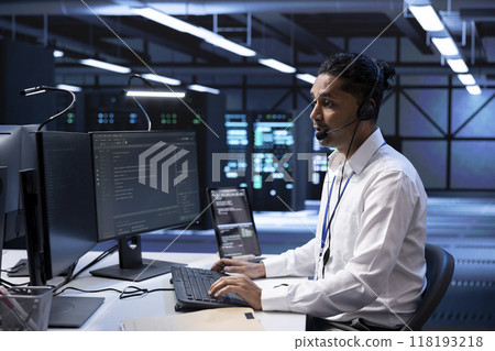 Technician in data center providing support for partnering startups, troubleshooting malfunctions. Worker in server hub call center carrying out operational interventions requested by clients Technician in data center providing support for partnering startups, troubleshooting malfunctions. Worker in server hub call center carrying out operational interventions requested by clients 118193218