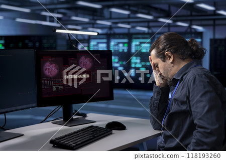 Technician in server hub doing face palm gesture, trying to protect hardware from hacker stealing information. Upset data center employee stressed by security breach alert caused by virus Technician in server hub doing face palm gesture, trying to protect hardware from hacker stealing information. Upset data center employee stressed by security breach alert caused by virus 118193260