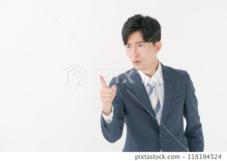 Angry businessman with his index finger up 118194524