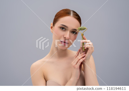 Fresh-faced pretty model undergoing wellness procedure with massager Fresh-faced pretty model undergoing wellness procedure with massager 118194611