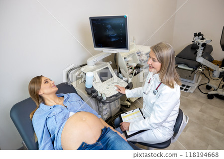 Young pregnant woman having appointment at female doctor 118194668