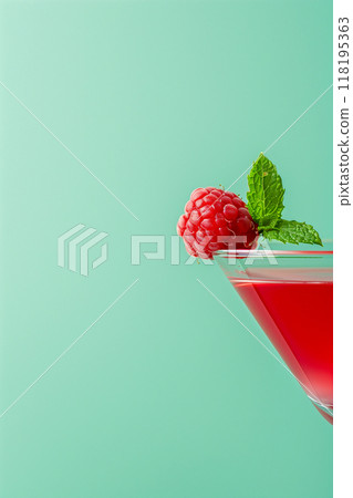 A glass of red wine with a raspberries on top 118195363