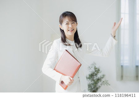 Woman in a white suit 118196411