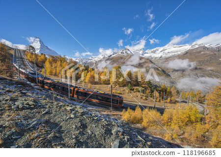 Zermatt Switzerland nature landscape of Matterhorn mountain peak and Gornergrat bahn train in Autumn Season 118196685