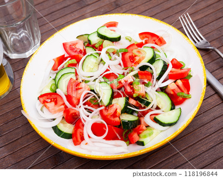 Appetizing cucumber and tomato salad closeup 118196844