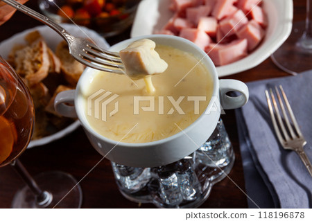Cheese fondue with bread and snacks 118196878