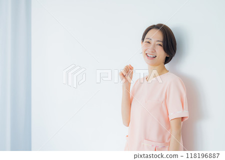 Nurse doing a guts pose Nurse doing a guts pose 118196887