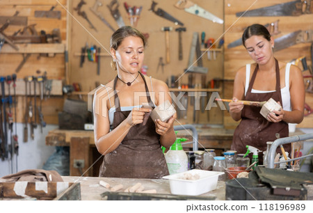 Girl is busy in carpentry workshop Girl is busy in carpentry workshop 118196989