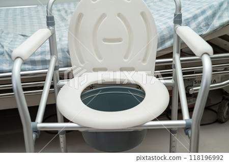 Flush toilet and shower chair in bathroom for old elder people. 118196992