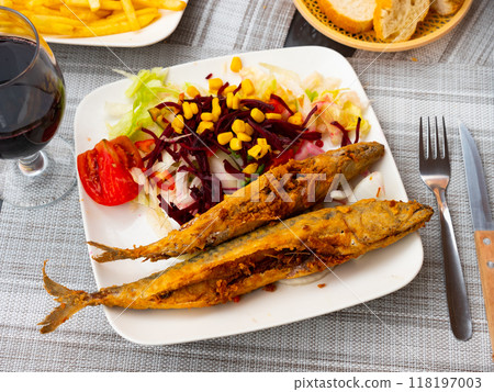 Fried mackerel with salad on four-square plate Fried mackerel with salad on four-square plate 118197003