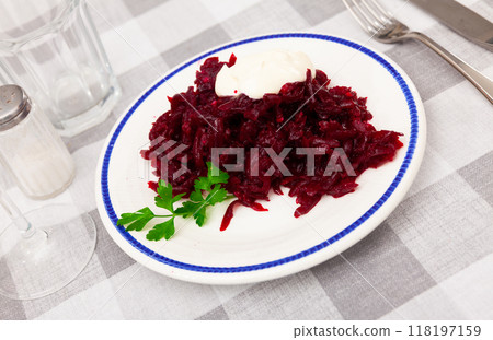 Salad of grated baked beetroot with sour cream and fresh parsley Salad of grated baked beetroot with sour cream and fresh parsley 118197159