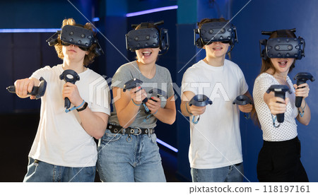 Womans and mans playing video games using virtual reality glasses 118197161