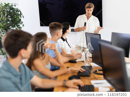 Male teacher enthusiastically explains Male teacher enthusiastically explains 118197201