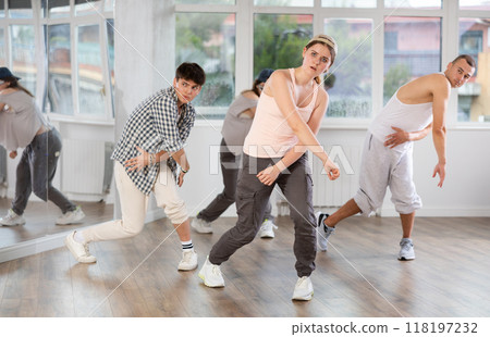 Hip-hop dance performed by group of young dancers in dance studio 118197232