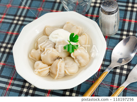 Delicious meat dumplings with sour cream 118197256