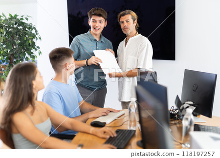 Among students of computer courses, male teacher awards diploma and to excellent guy pupil Among students of computer courses, male teacher awards diploma and to excellent guy pupil 118197257