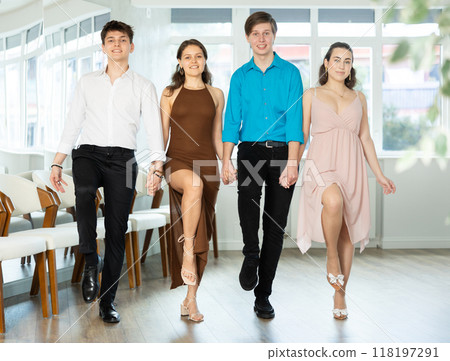 Group of young guys and women dancing folk dance 118197291