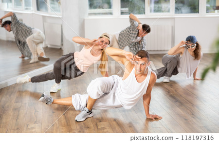 Group of dancers having break dance training at dance studio Group of dancers having break dance training at dance studio 118197316
