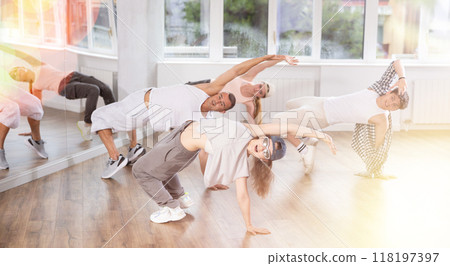 Young girl practicing breakdance in training hall 118197397