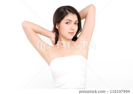 Beautiful Young Asian woman lifting hands up to show off clean and hygienic armpits or underarms on white background, Smooth armpit cleanliness and protection concept 118197994