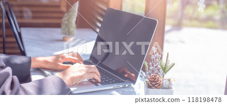 Woman working on laptop computer in office.For web banner. Woman working on laptop computer in office.For web banner. 118198478