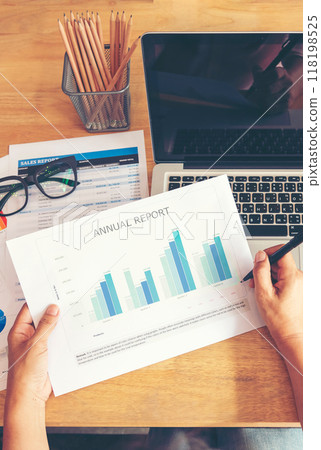 Vertical Businesswoman reading financial graph charts business info with computer laptop. Vertical horizon Women hands using laptop on office desk. Close up hands of business woman working office 118198525
