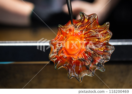 Molten glass in shape of a flower 118200469