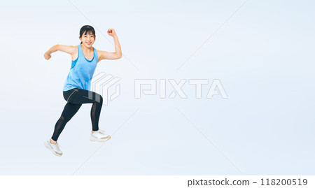 Full body photo of a girl in sportswear jumping Full body photo of a girl in sportswear jumping 118200519