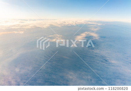 Beautiful orange and pink sunrise over the clouds, view from the plane. 118200820