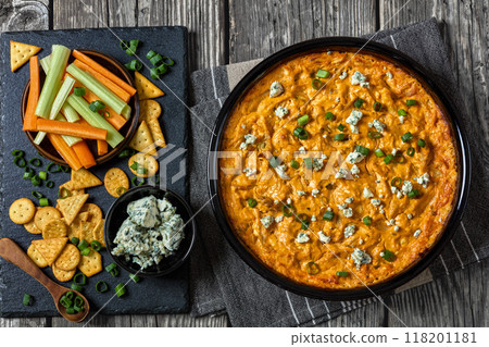 hot buffalo chicken dip in baking dish, top view hot buffalo chicken dip in baking dish, top view 118201181