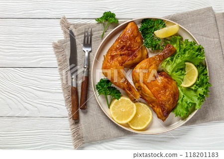 fried chicken legs with lettuce, lemon on plate fried chicken legs with lettuce, lemon on plate 118201183
