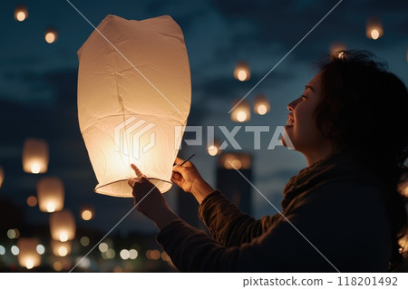 Lantern festival joy: Celebrating vibrant lantern festival with colorful lanterns illuminating night sky, showcasing traditional customs and festive spirit of cherished cultural event 118201492
