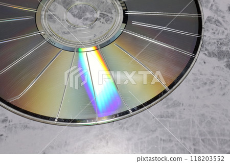 A CD with radial scratches made with a cutter A CD with radial scratches made with a cutter 118203552