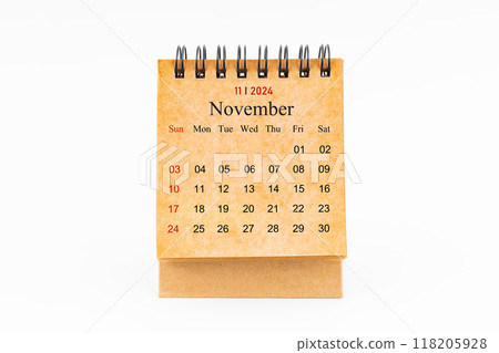 Brown mini desk calendar for November 2024 isolated on white. Brown mini desk calendar for November 2024 isolated on white. 118205928
