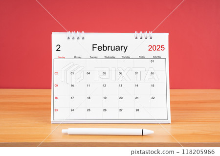 February monthly desk calendar for 2025 year and pen on the wooden table. February monthly desk calendar for 2025 year and pen on the wooden table. 118205966