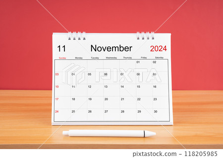 November monthly desk calendar for 2024 year and pen on the wooden table. 118205985