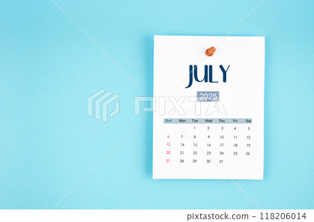 July 2025 calendar page with push pin on blue background. 118206014