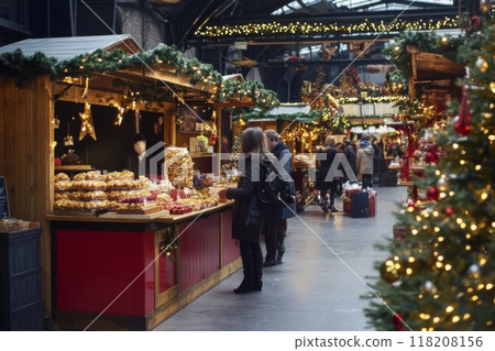 Christmas Market Stall with a Woman Shopping for Treats Christmas Market Stall with a Woman Shopping for Treats 118208156