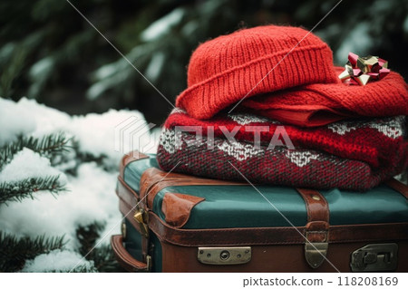Red Knit Hat and Scarf Stacked on Vintage Suitcase Red Knit Hat and Scarf Stacked on Vintage Suitcase 118208169