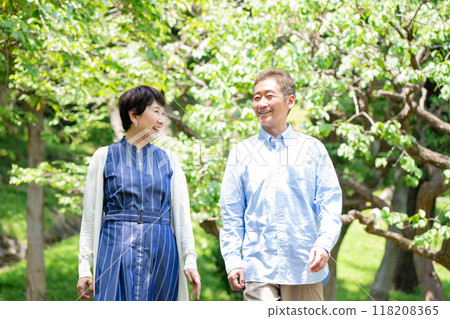 Senior couple taking a walk on a sunny day 118208365