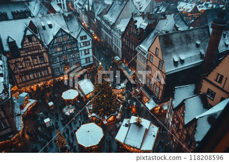 Aerial View of a Snow-Covered Christmas Market in a European Town 118208596