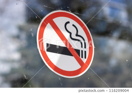 A Clear No Smoking Sign Displayed on a Transparent Glass Surface for Public Awareness 118209004