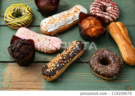 Mix of muffins ( cupcake ) chocolate , vanilla , berries . Top view 118209078