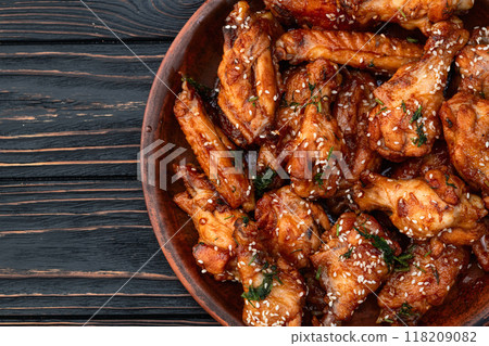 Caramelized in sause chicken wings . Bar-b-q food background photo Caramelized in sause chicken wings . Bar-b-q food background photo 118209082