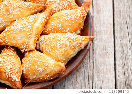 Homemade triangle puff pastry with meat on rustic background . Samosa 118209143