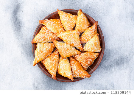 Homemade triangle puff pastry with meat on rustic background . Samosa Homemade triangle puff pastry with meat on rustic background . Samosa 118209144