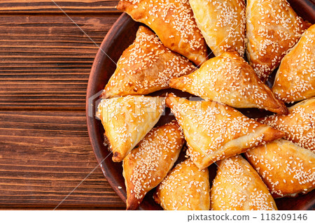 Homemade triangle puff pastry with meat on rustic background . Samosa 118209146