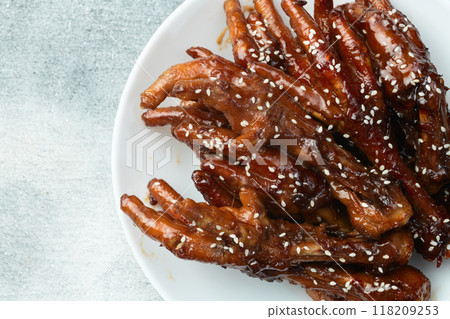Caramelized korean or Chinese chicken foots ( paws ) with sesame . Top view 118209253