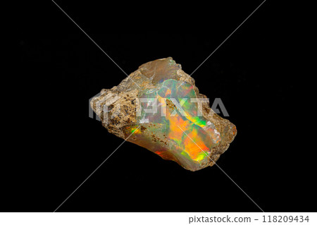 macro mineral stone rare and beautiful opals on a black background 118209434